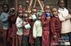 Row of Children Waiting for Porridge, by Masja Stolk