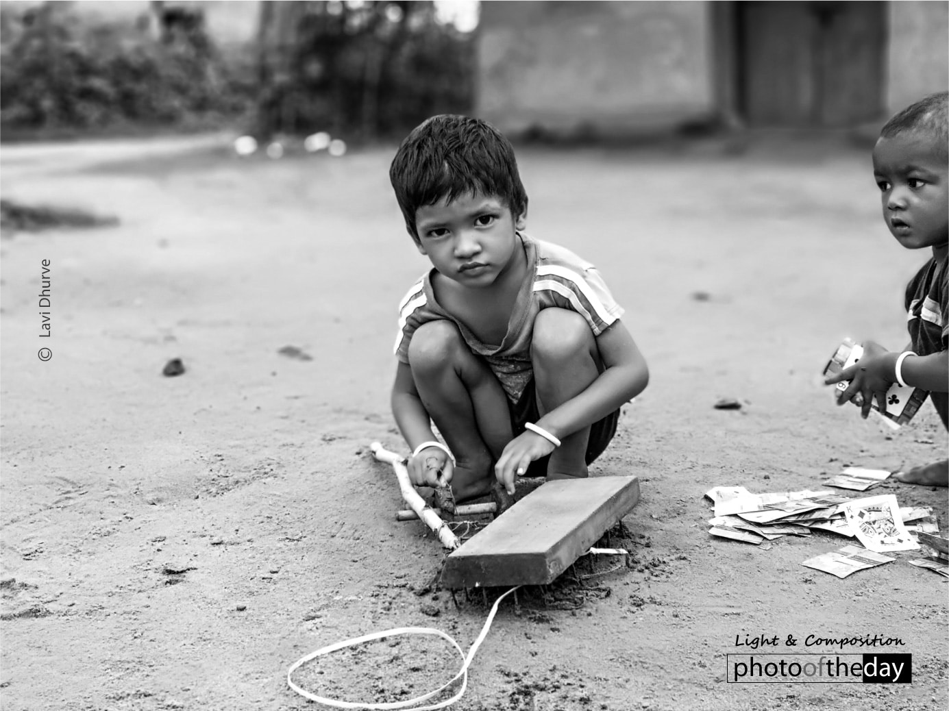 Playing with a Wooden Car by Lavi Dhurve