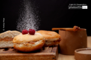 Caramel Sauce Doughnut with Powdered Sugar by Rodrigo Aliaga