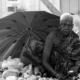 The Street Grandma with Hand of Flowers by Karthick Saravanan